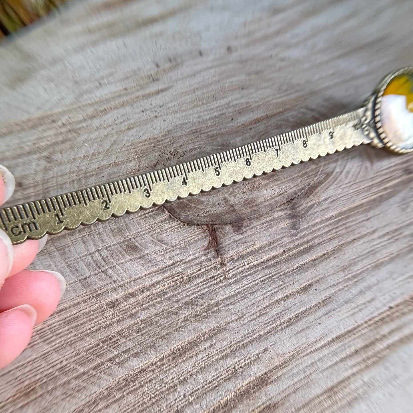 Bookmark with real Black Eyed Susan preserved in resin and bronze bezel