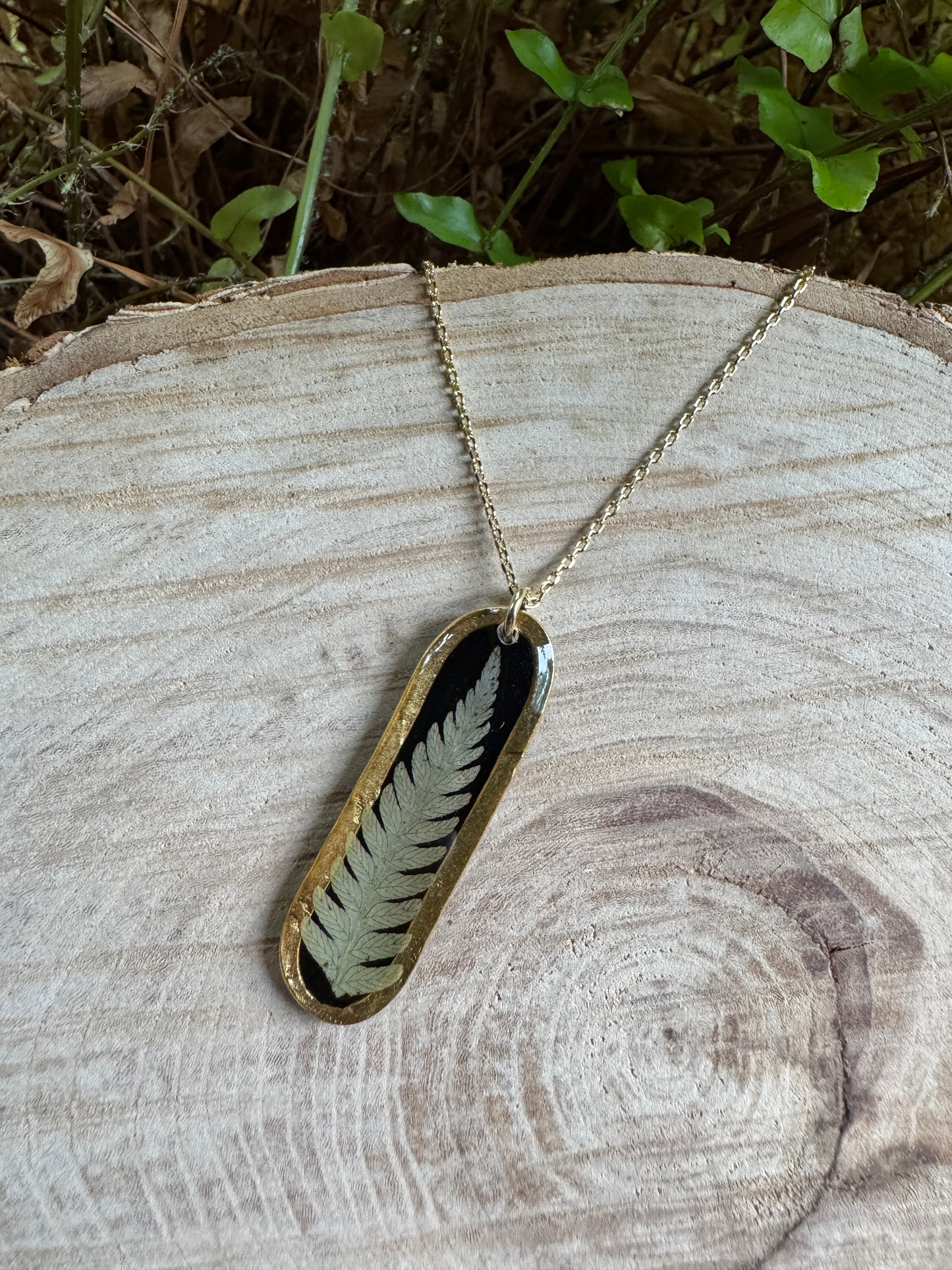 Necklace with real fern frond preserved in resin and gold filled bezel