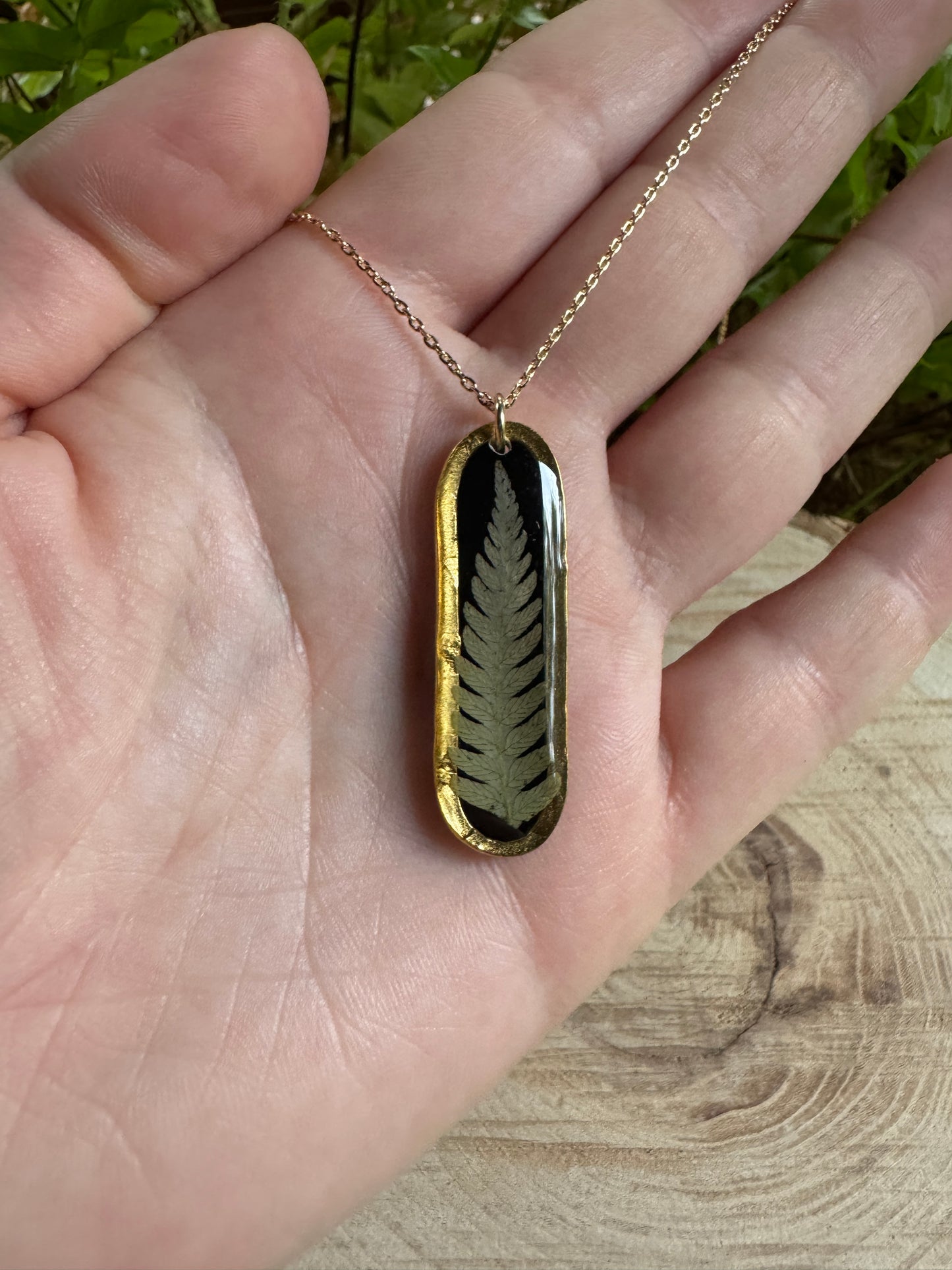 Necklace with real fern frond preserved in resin and gold filled bezel