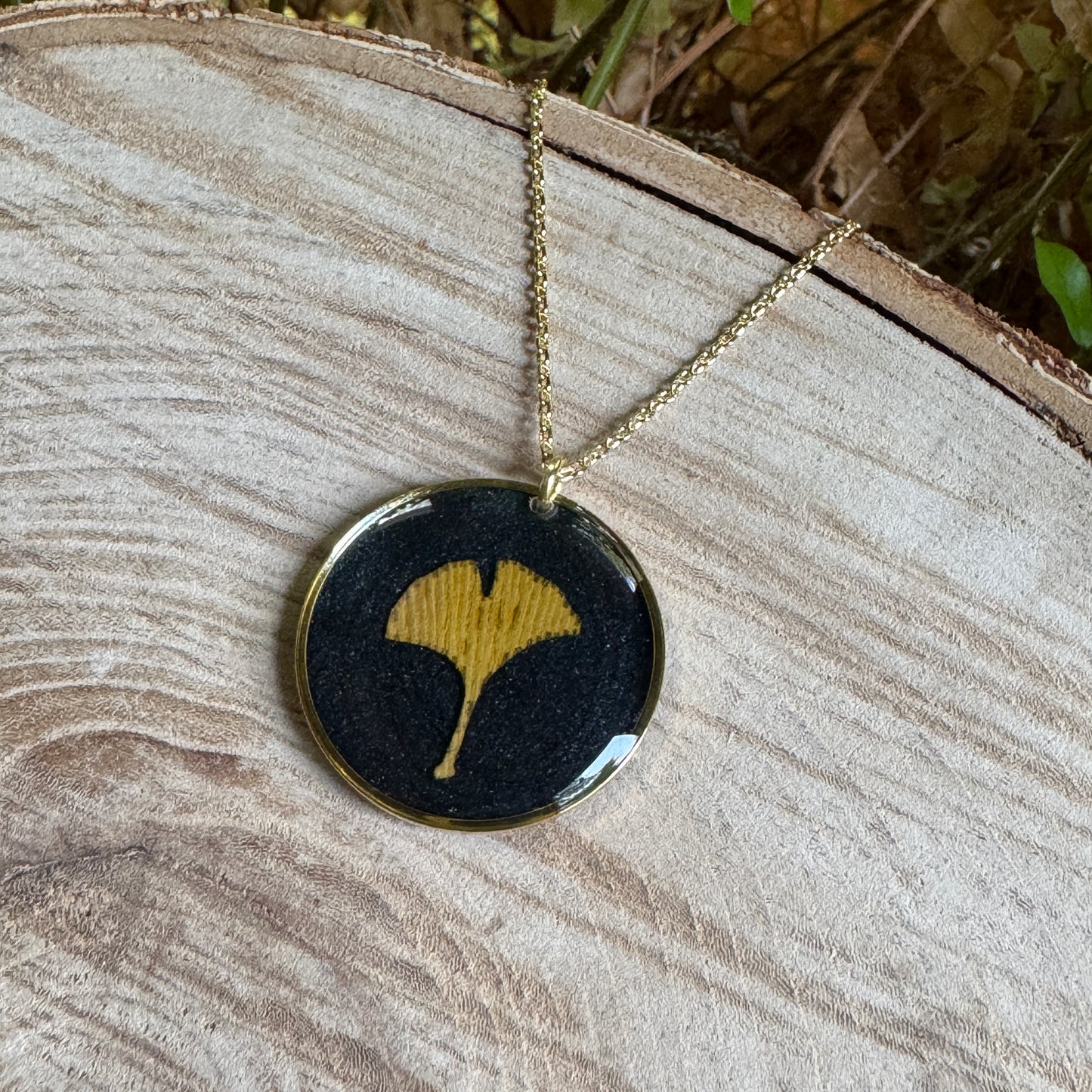 Handcrafted ginkgo leaf necklace in gold filled with organic botanical detail