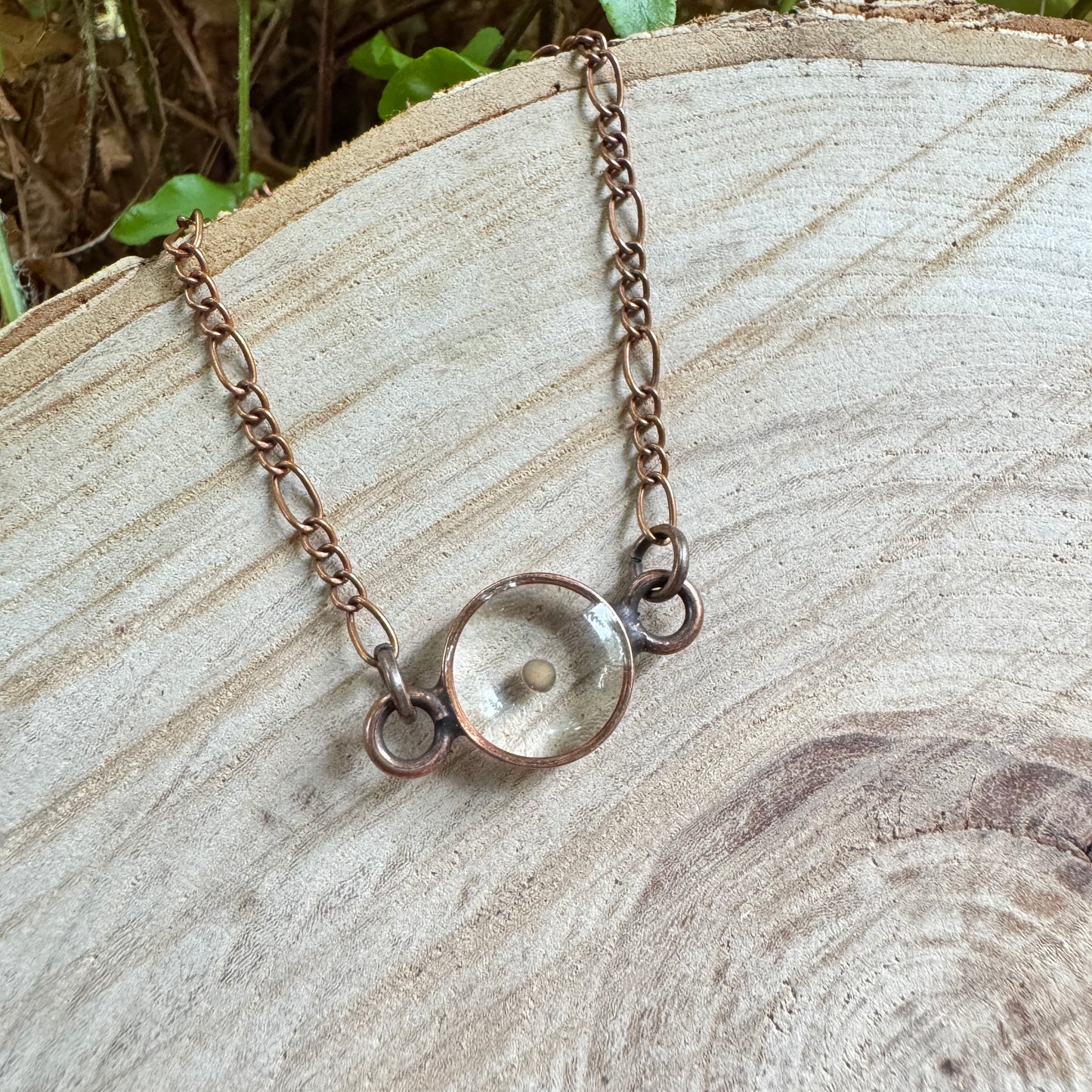 Real mustard seed preserved in resin necklace with copper bezel