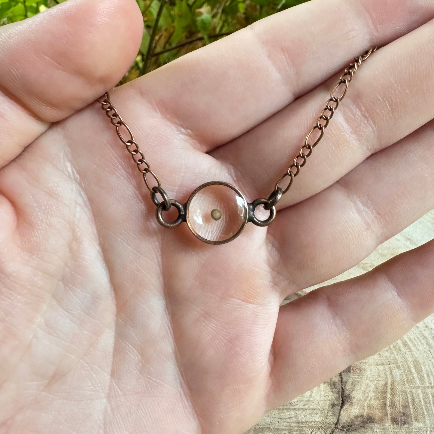 Real mustard seed preserved in resin necklace with copper bezel