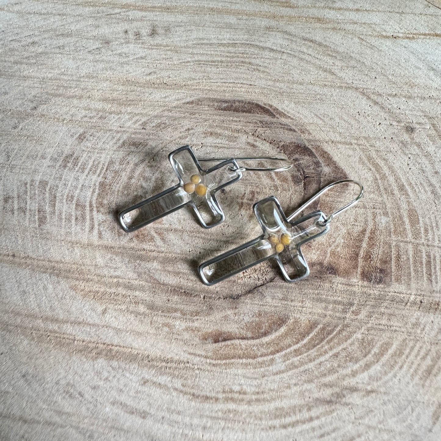Silver cross earrings with real mustard seeds preserved in resin