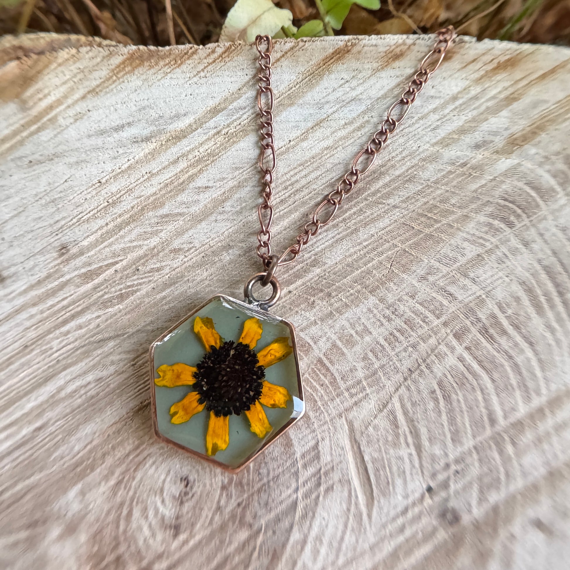 Necklace with real Black Eyed Susan flower preserved in resin and copper bezel