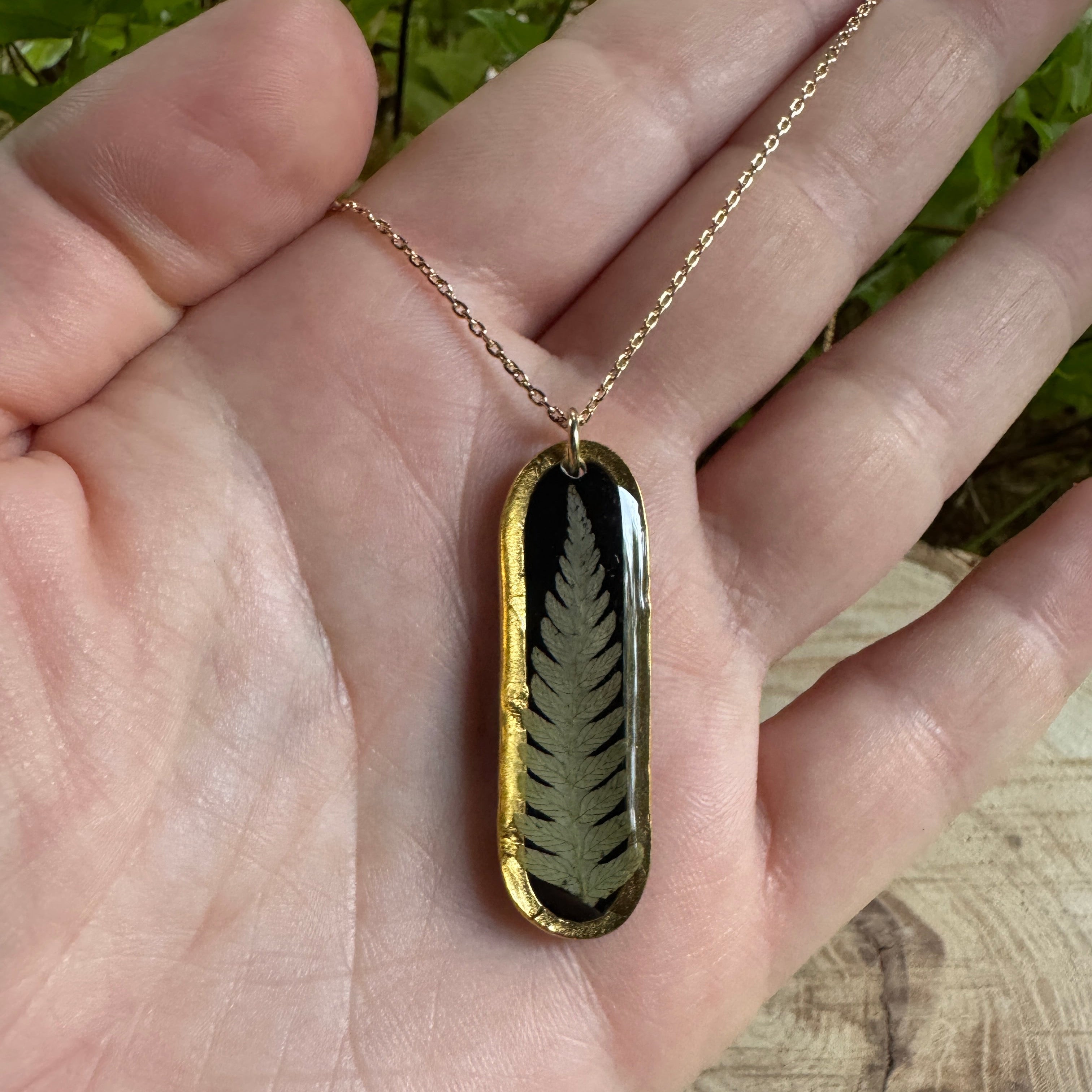 Necklace with real fern frond preserved in resin and gold filled bezel