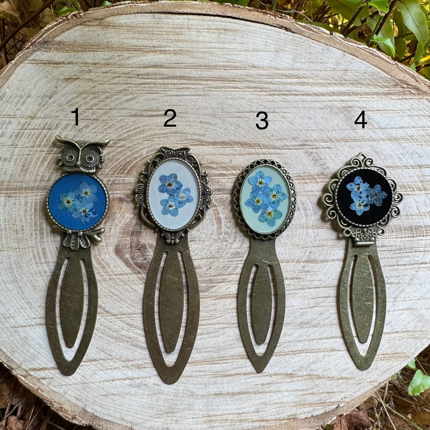 Handmade forget-me-not bookmark with real pressed flowers in resin and bronze bezel