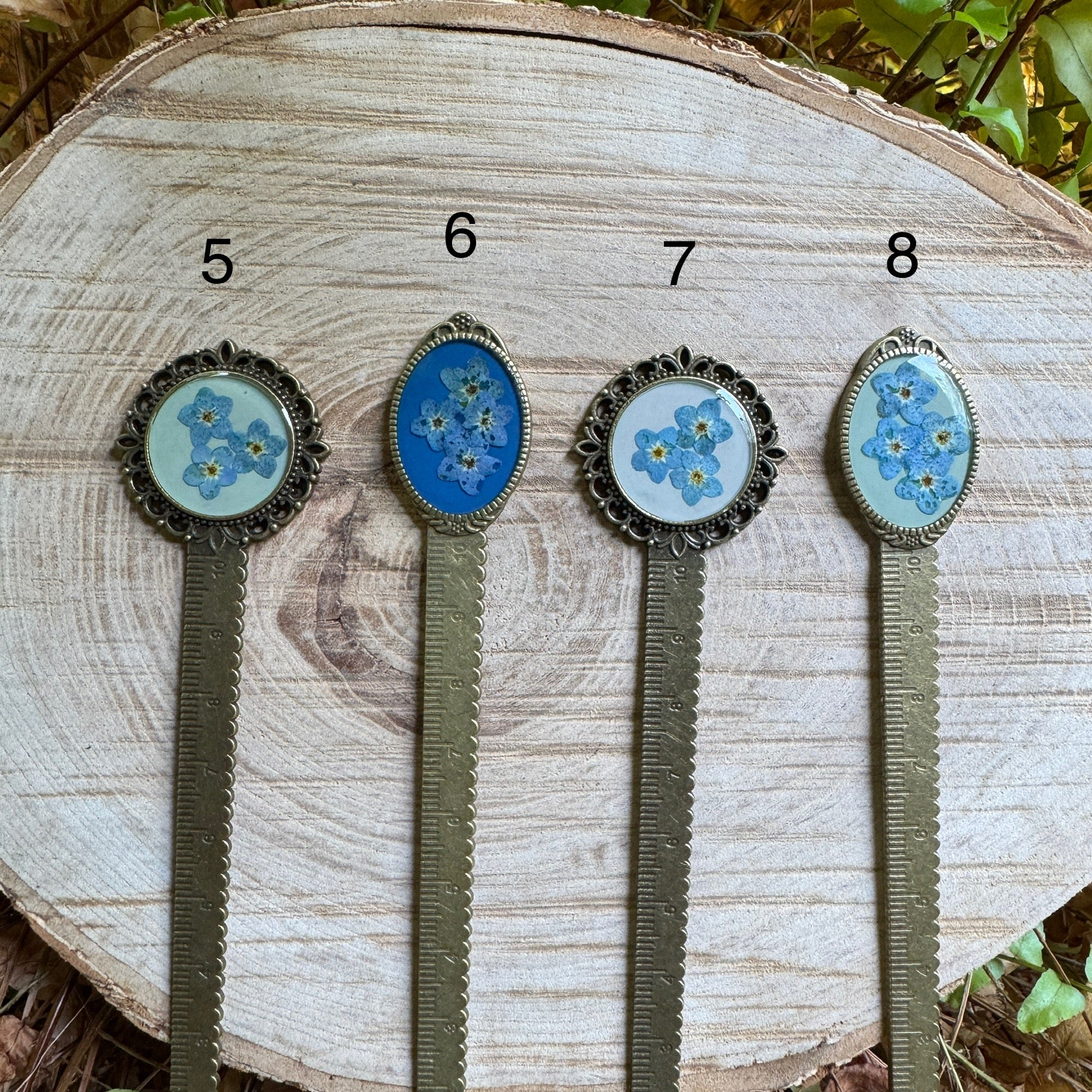 Handmade forget-me-not bookmark with real pressed flowers in resin and bronze bezel