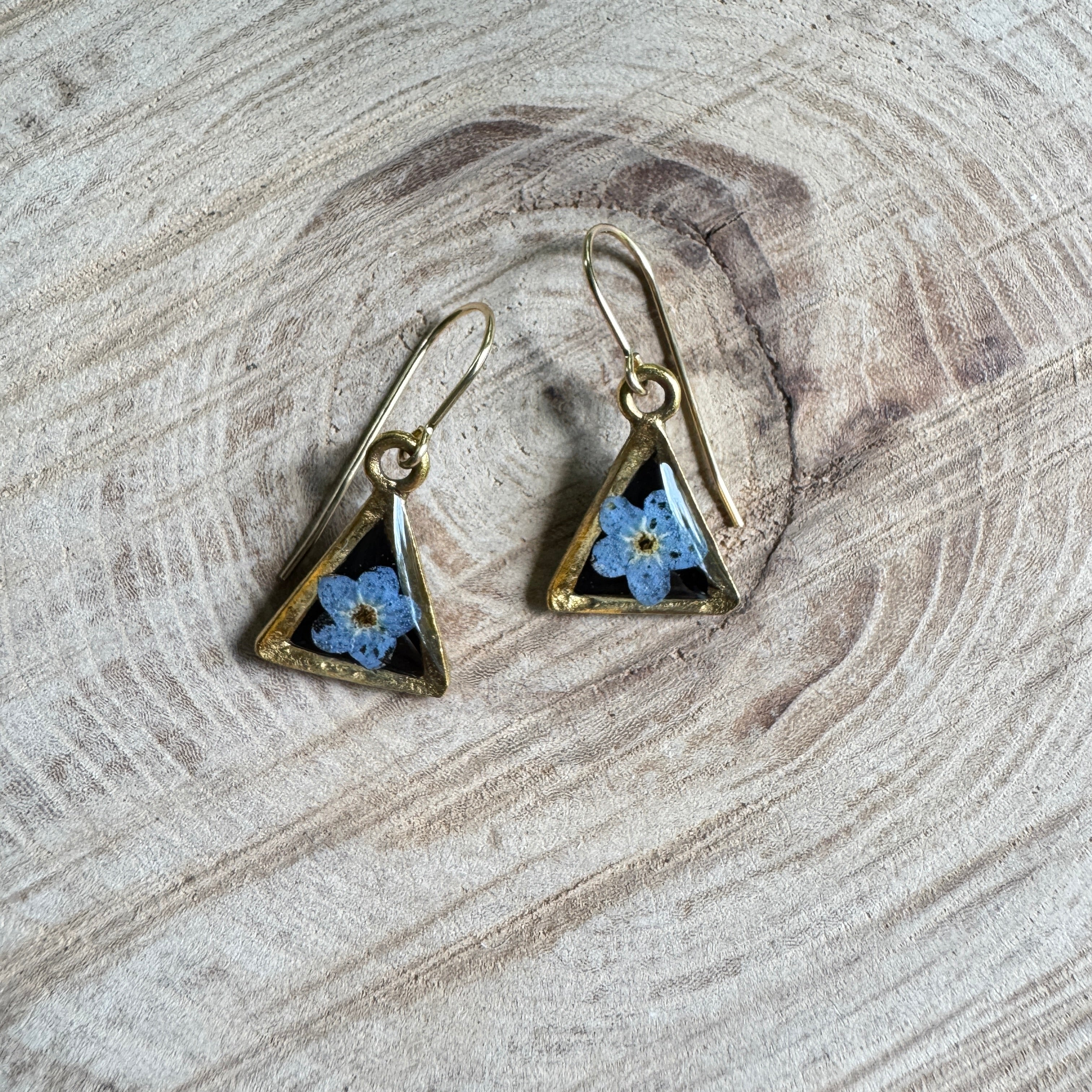 Earrings with real forget-me-not flowers preserved in resin and set in gold filled bezels