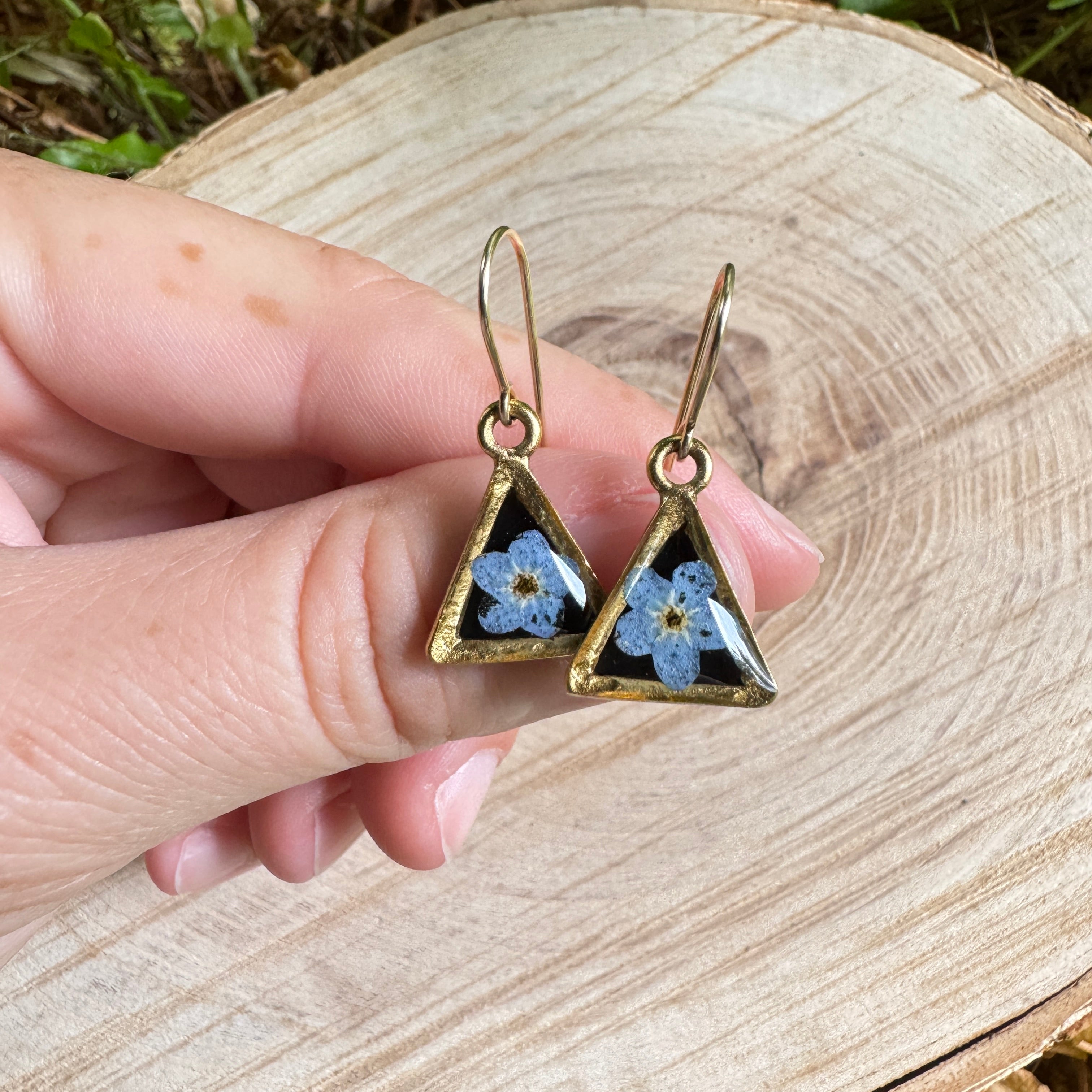 Earrings with real forget-me-not flowers preserved in resin and set in gold filled bezels