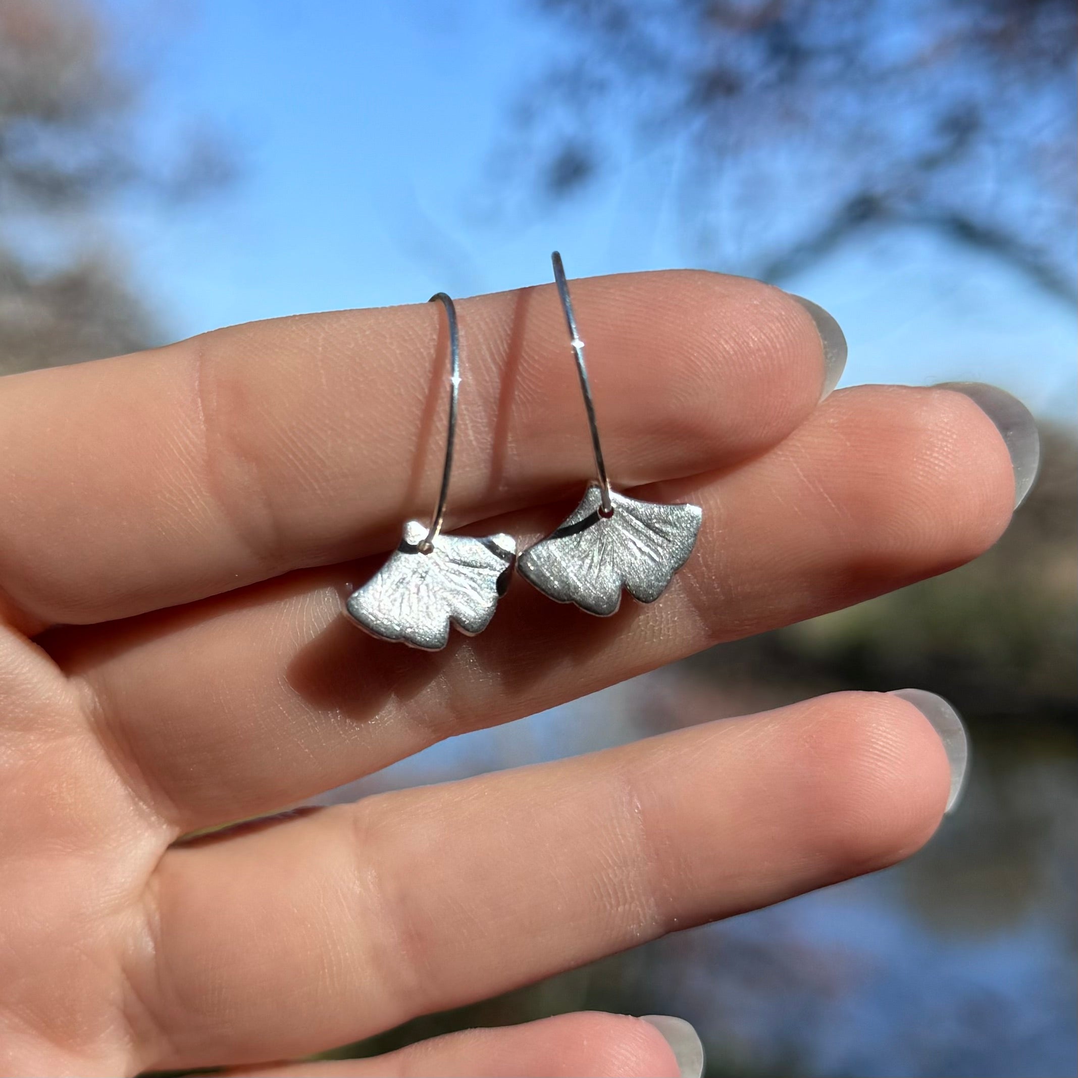 Silver ginkgo leaf earrings with handcrafted botanical design