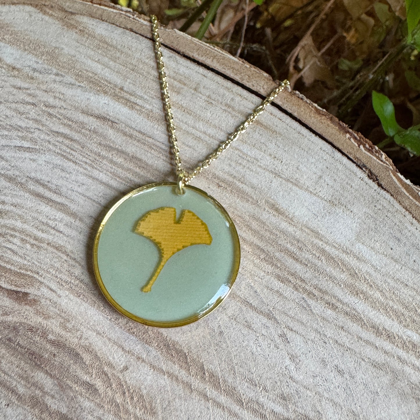 Handcrafted ginkgo leaf necklace in gold filled with organic botanical detail