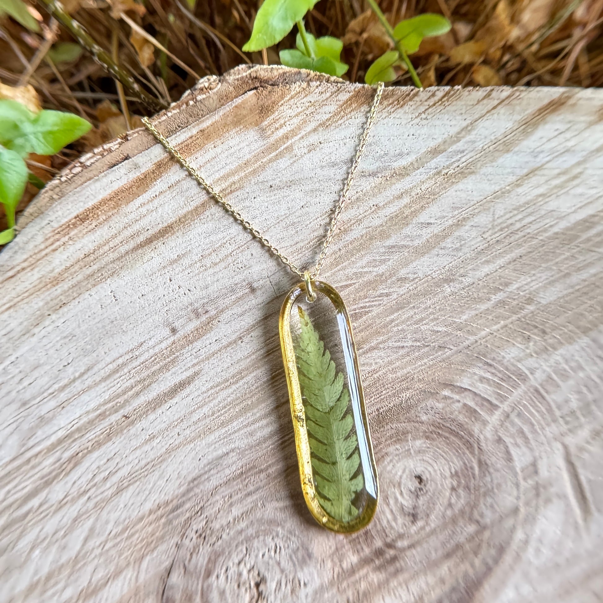 Necklace with real fern frond preserved in resin and gold filled bezel