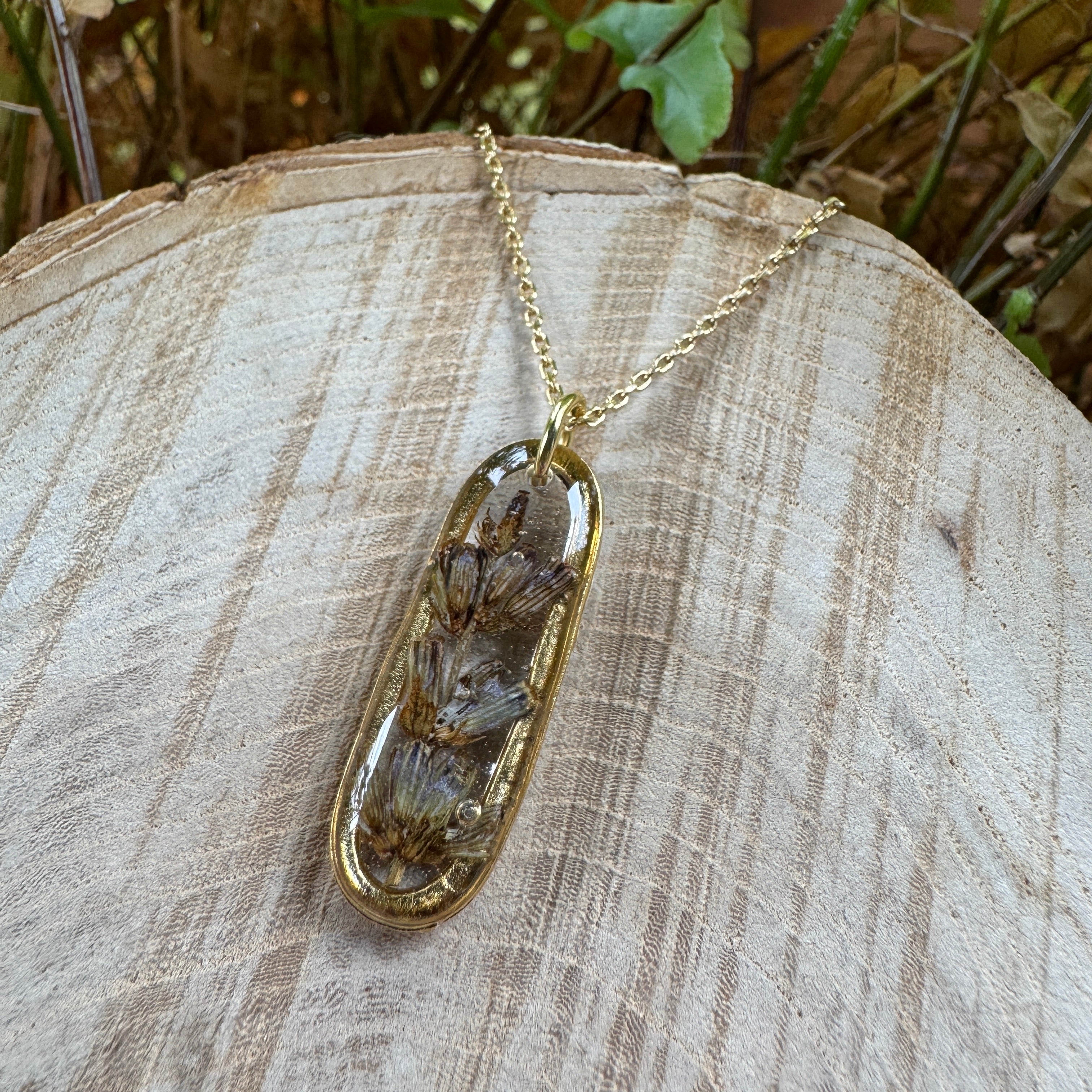 Handmade real lavender oval necklace featuring preserved lavender in resin with First Light clear background, available in gold filled.