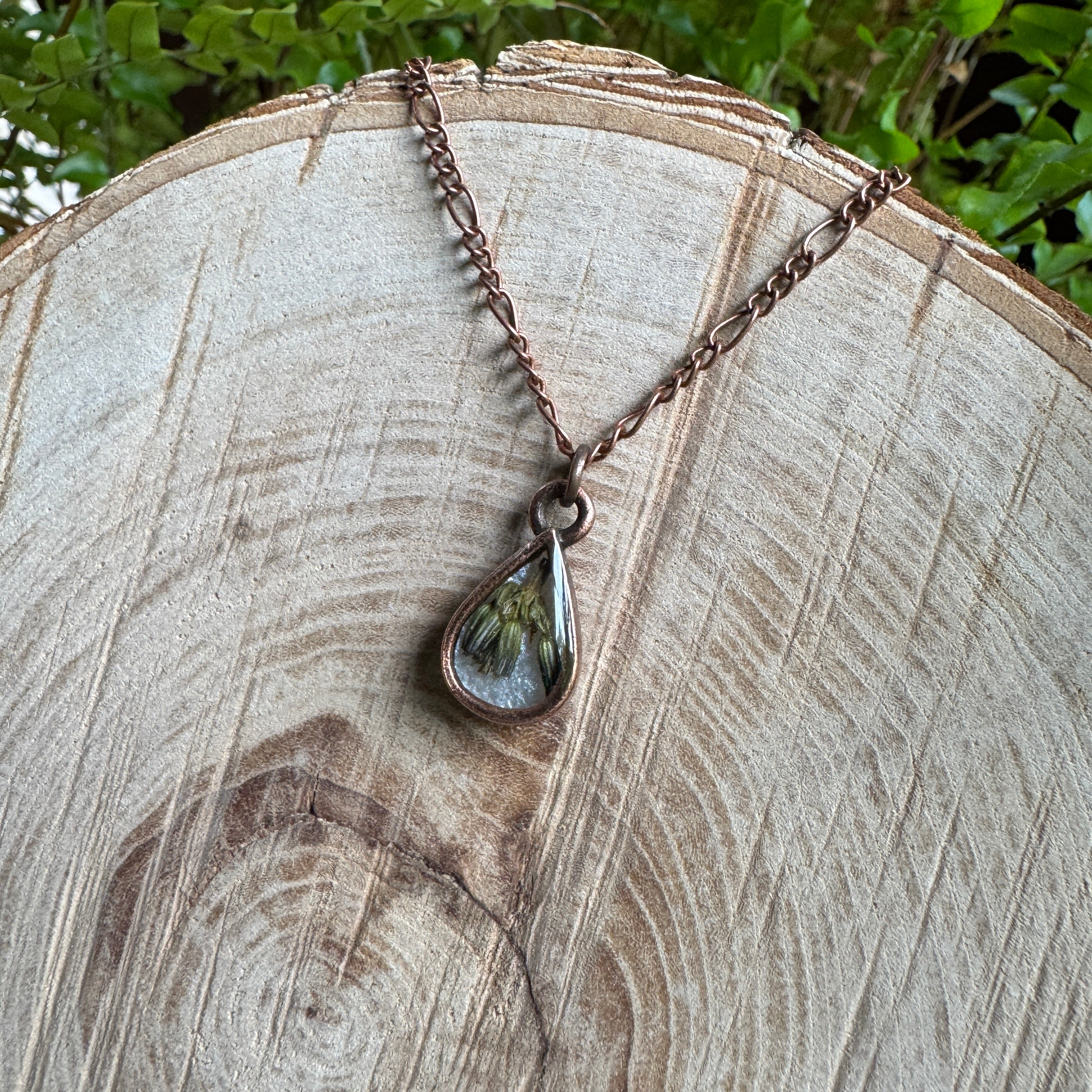 Handmade real lavender teardrop necklace featuring preserved lavender in resin with Morning Mist white background, available in antique copper.
