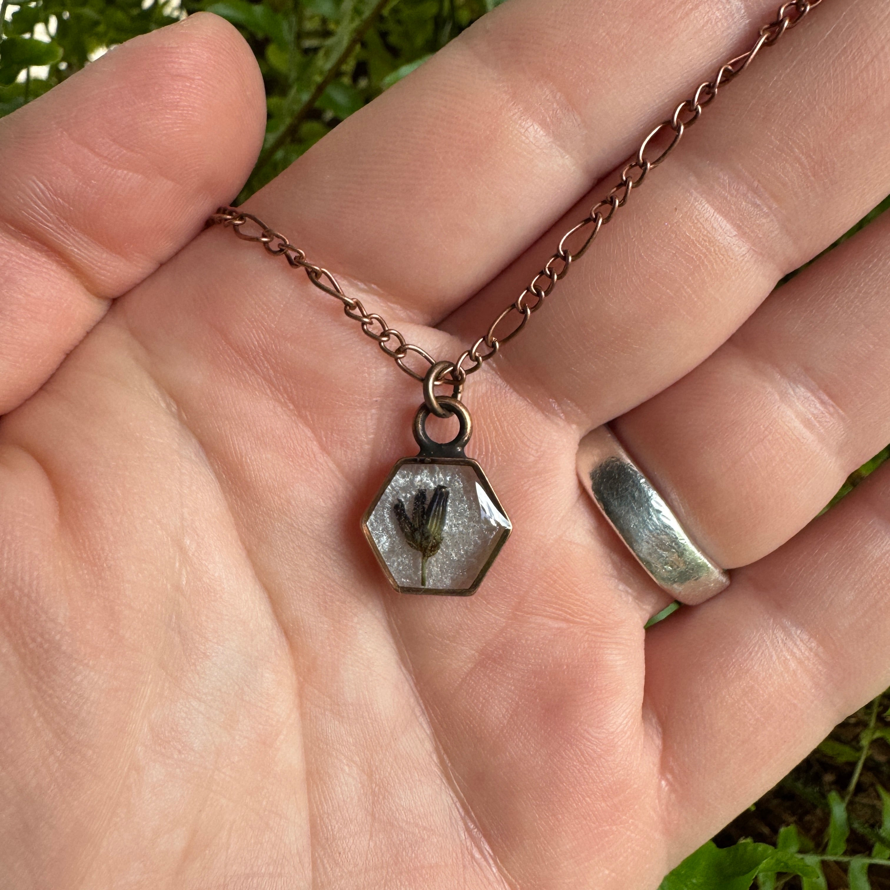 Handmade real lavender hexagon necklace featuring preserved lavender in resin with a Morning Mist white background, available in antique copper.