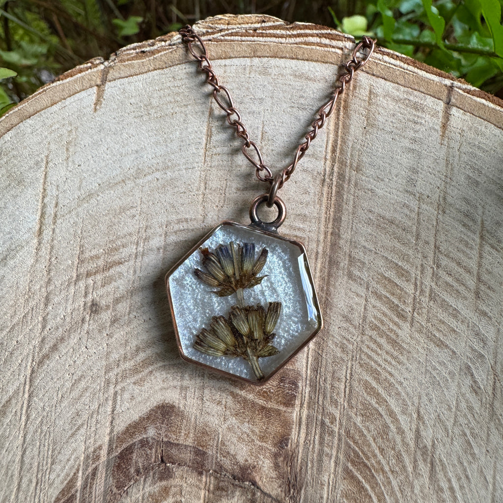 Handmade real lavender hexagon necklace featuring preserved lavender in resin with a Morning Mist white background, available in antique copper.