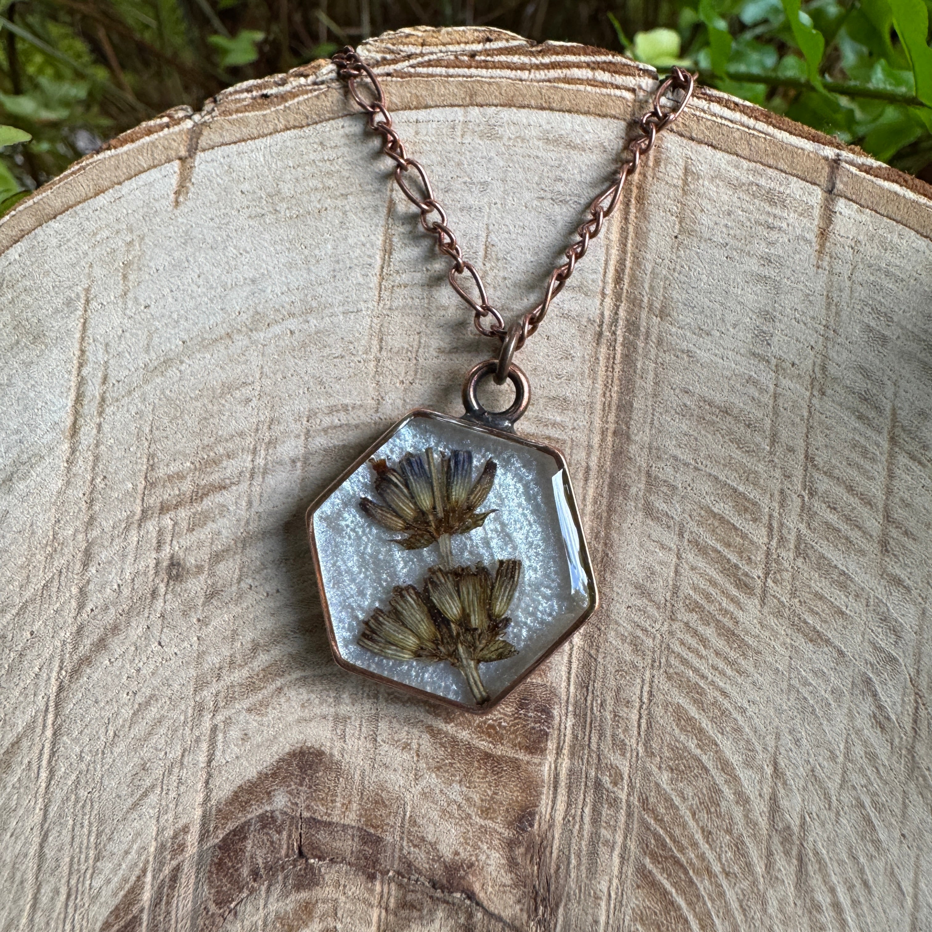 Handmade real lavender hexagon necklace featuring preserved lavender in resin with a Morning Mist white background, available in antique copper.