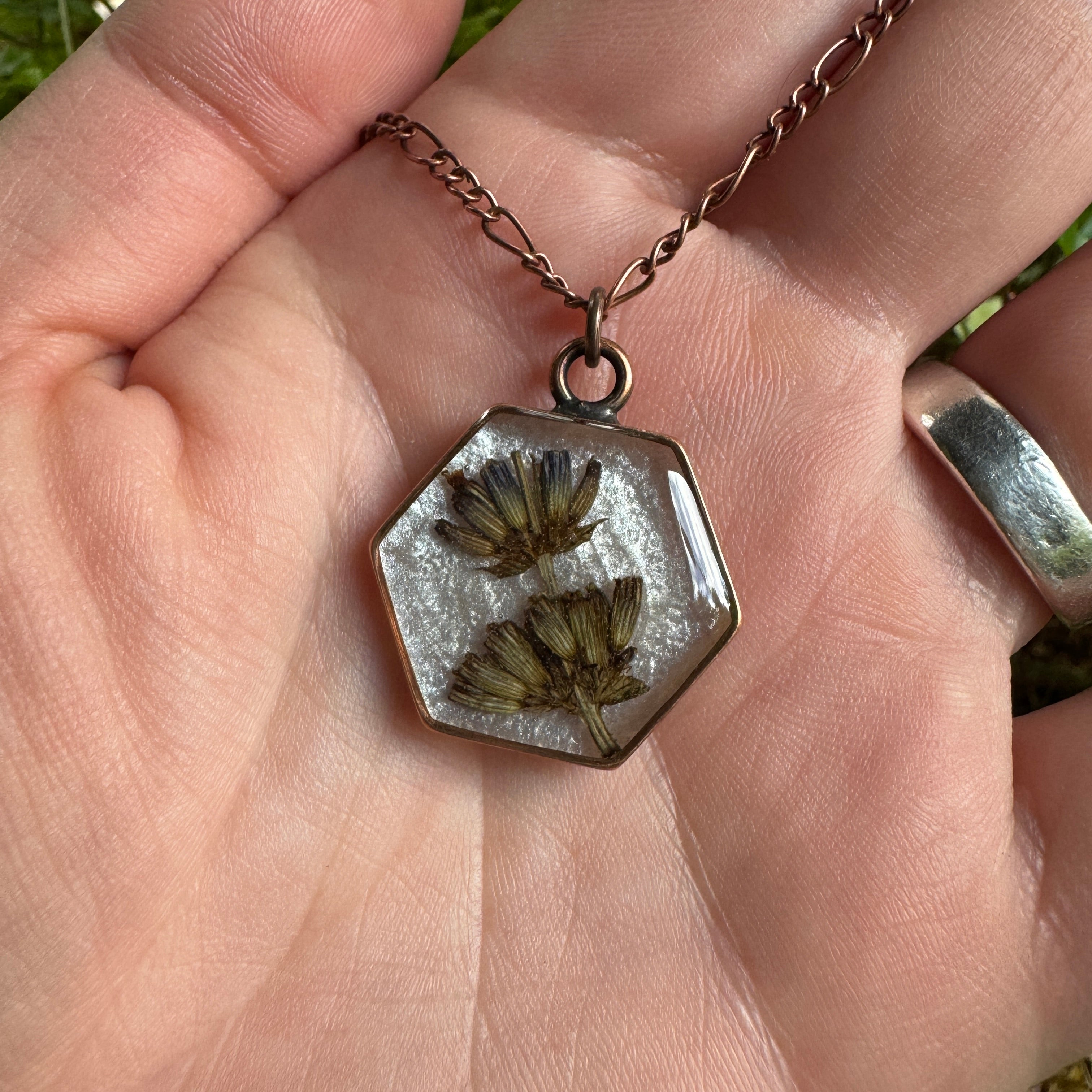 Handmade real lavender hexagon necklace featuring preserved lavender in resin with a Morning Mist white background, available in antique copper.