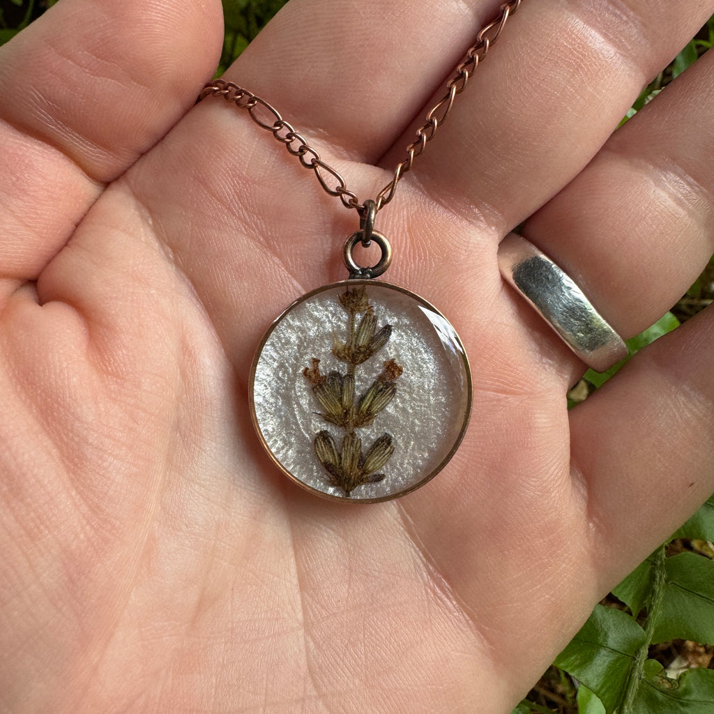 Handmade real lavender circle necklace with preserved lavender in resin, available in Morning Mist white background in antique copper.