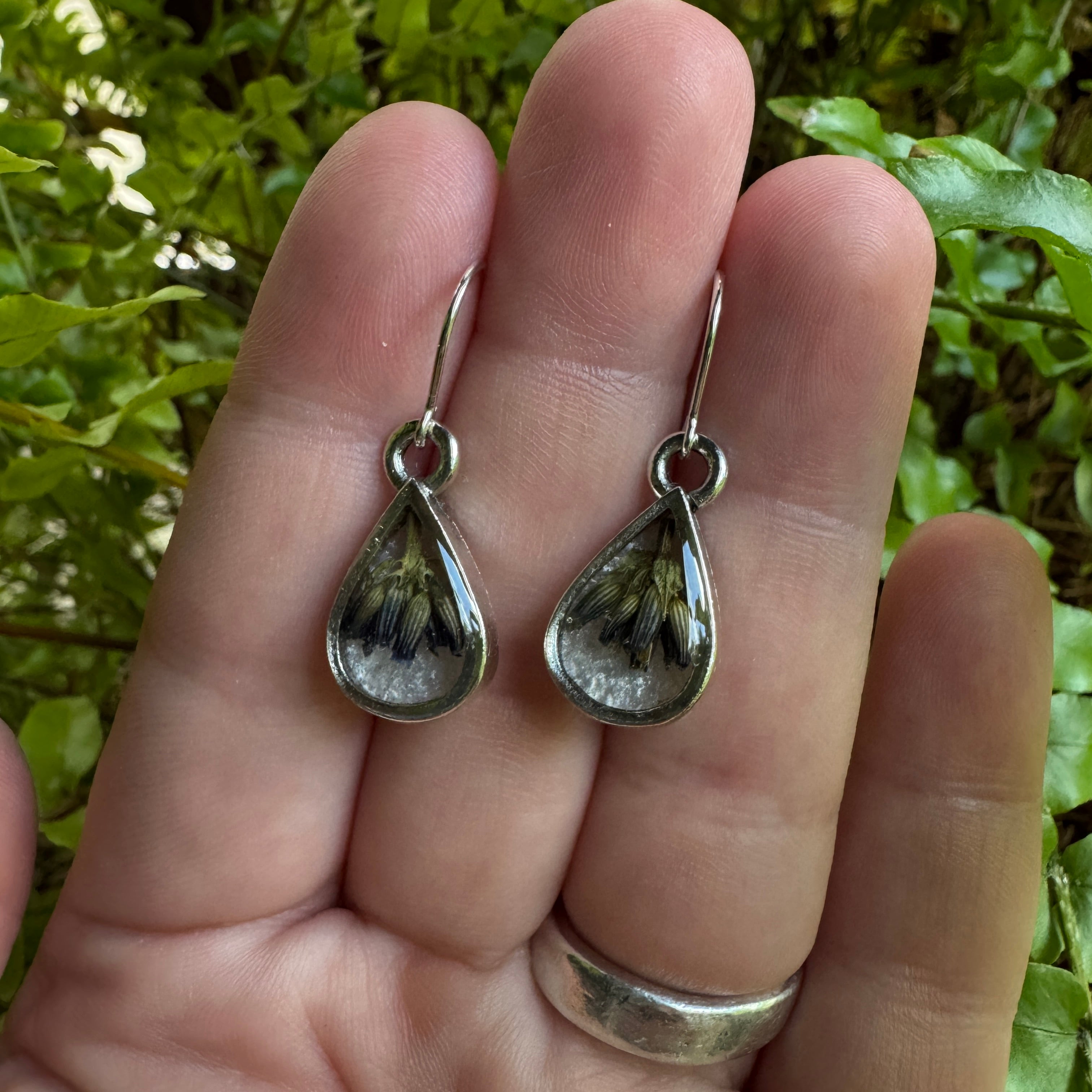 Handmade real lavender teardrop earrings featuring preserved lavender in resin, available in sterling silver.