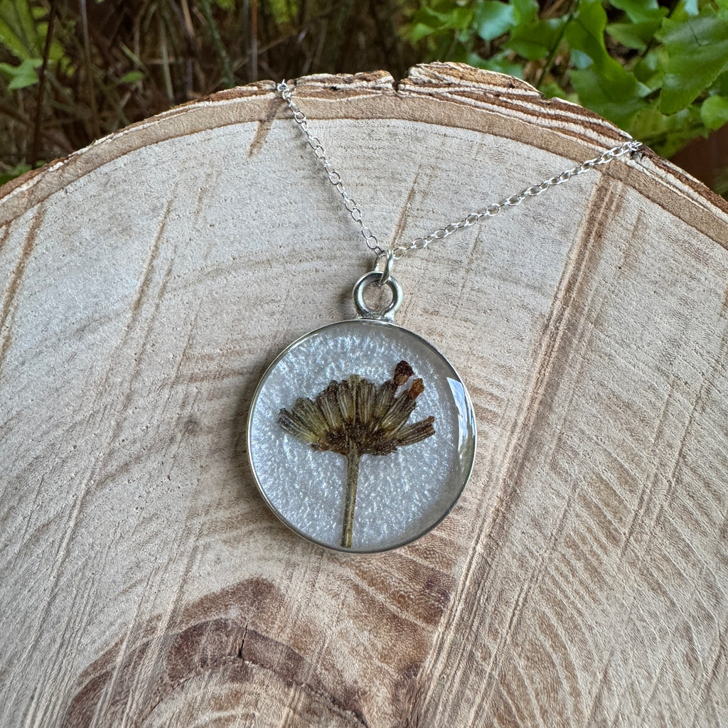 Handmade real lavender circle necklace with preserved lavender in resin, available in Morning Mist white background in sterling silver.