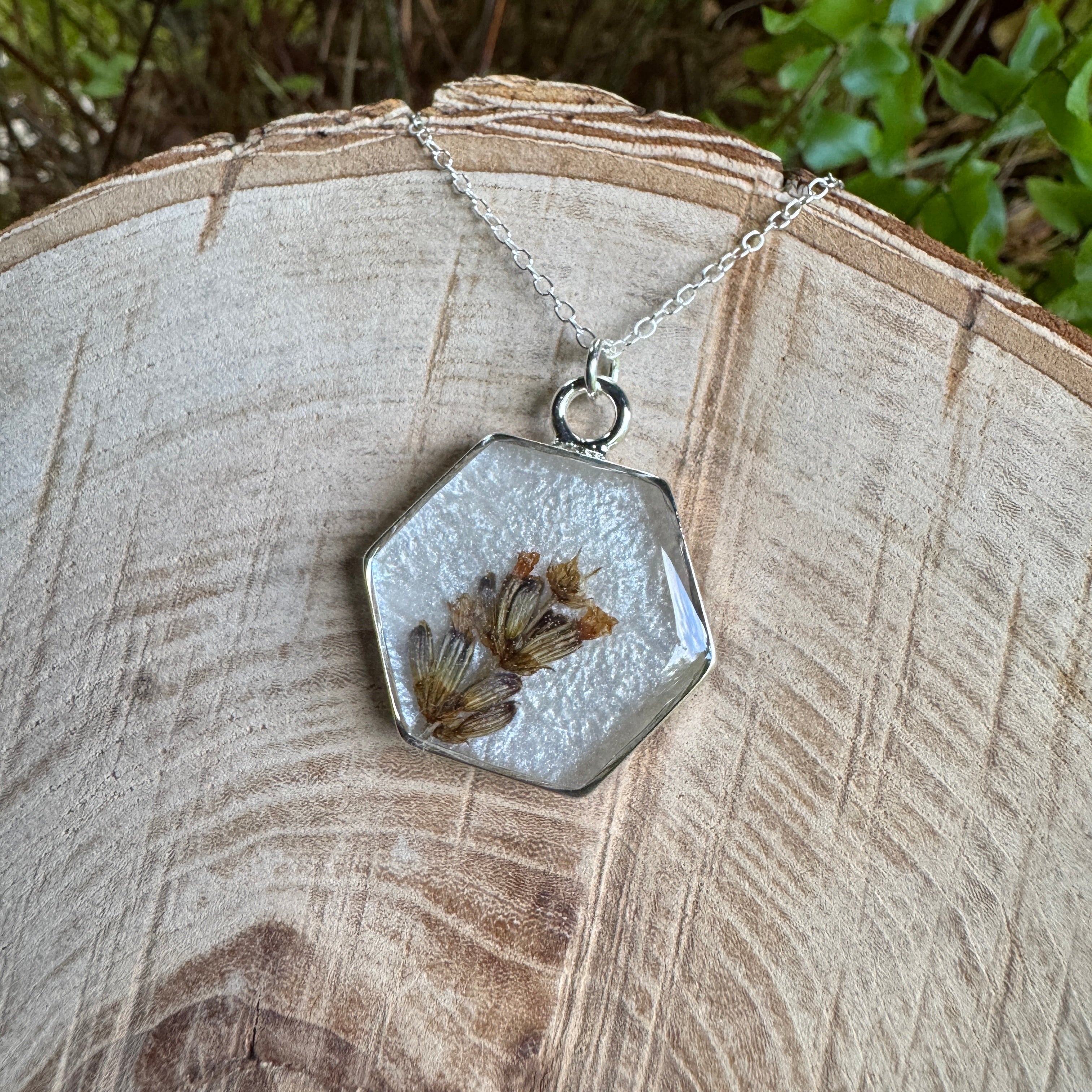Handmade real lavender hexagon necklace featuring preserved lavender in resin with a Morning Mist white background, available in sterling silver.