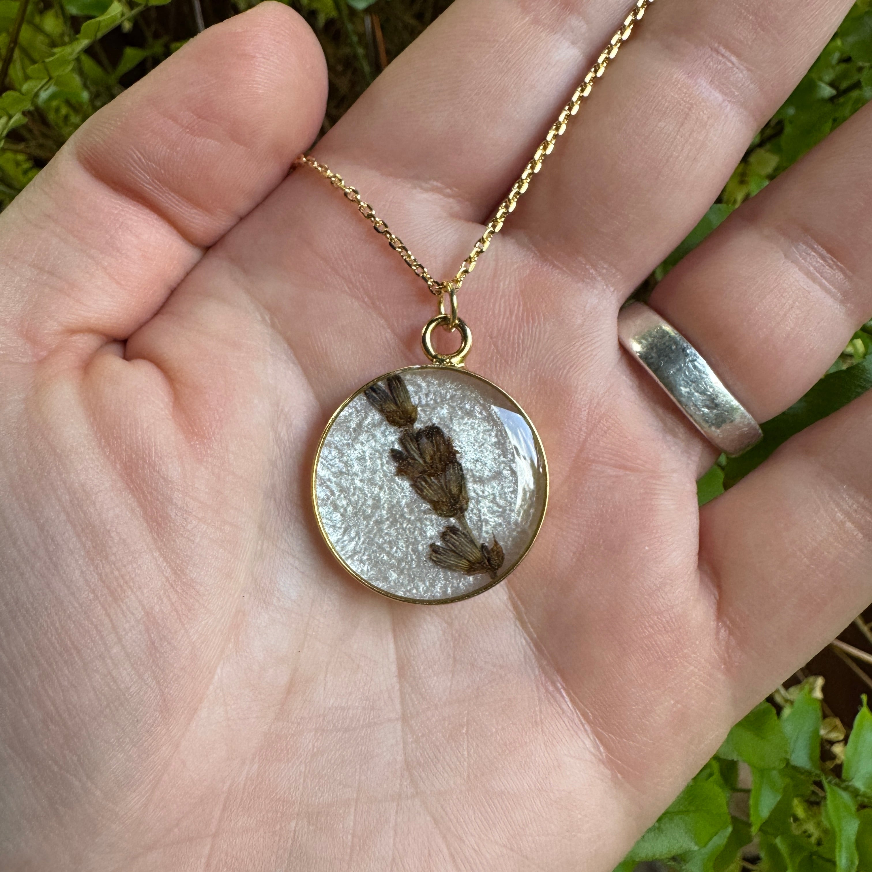 Handmade real lavender circle necklace with preserved lavender in resin, available in Morning Mist white background in gold filled.