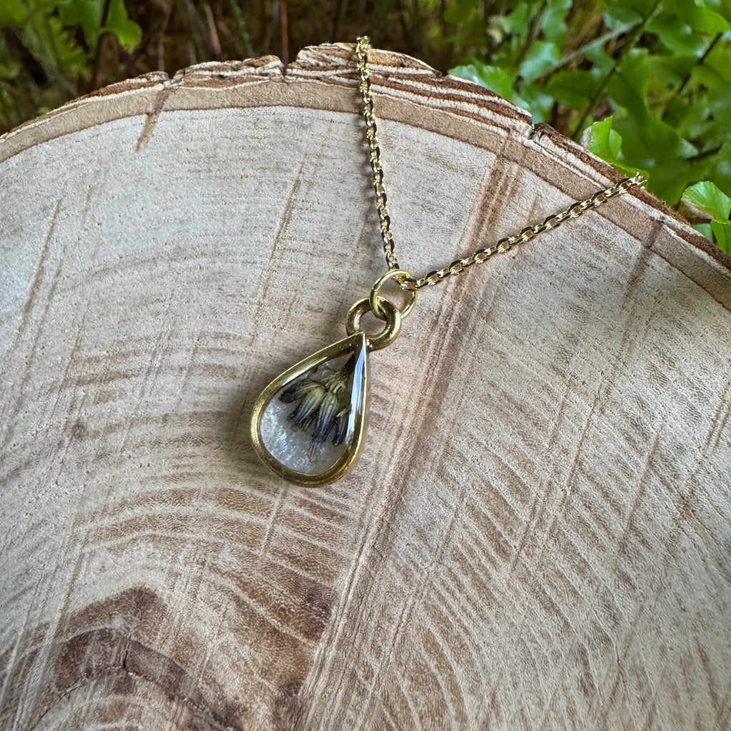 Handmade real lavender teardrop necklace featuring preserved lavender in resin with Morning Mist white background, available in gold filled.