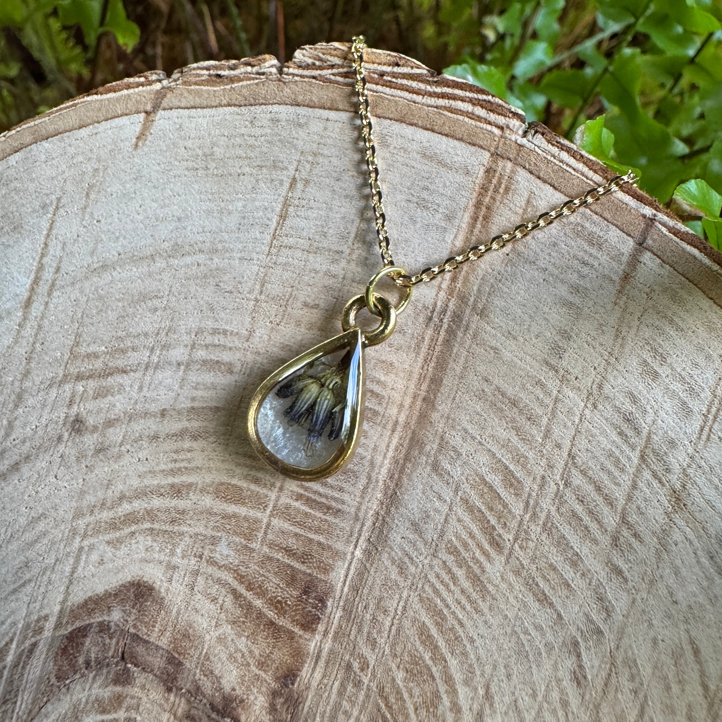 Handmade real lavender teardrop necklace featuring preserved lavender in resin with Morning Mist white background, available in gold filled.