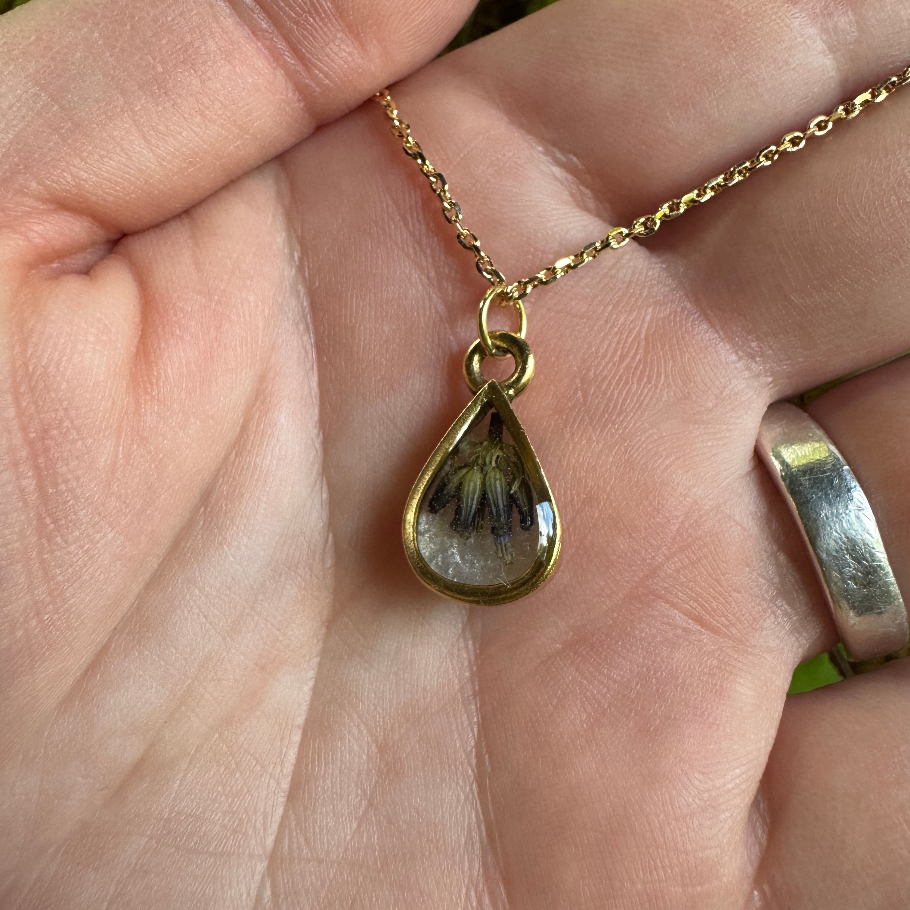 Handmade real lavender teardrop necklace featuring preserved lavender in resin with Morning Mist white background, available in gold filled.