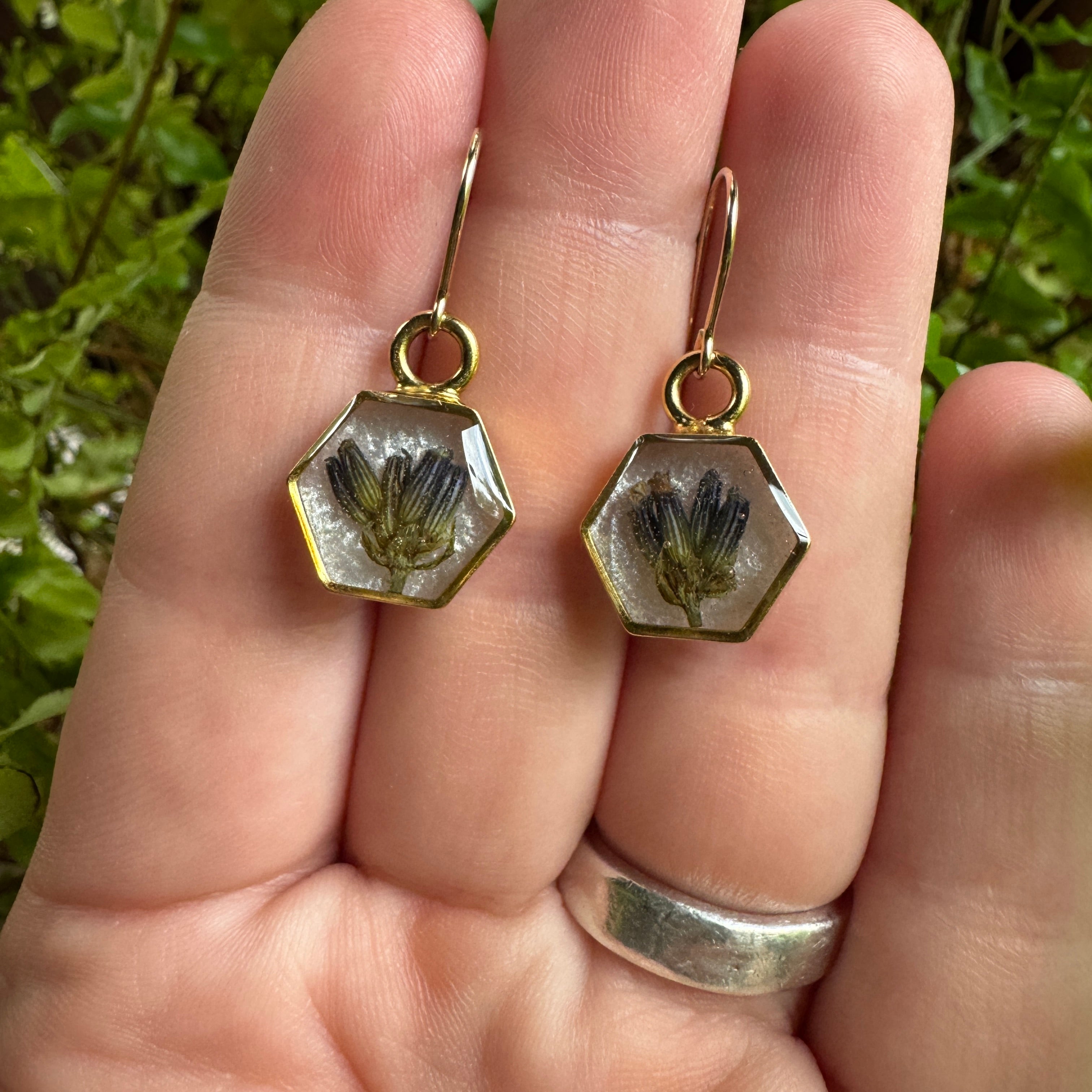 One-of-a-kind handmade gold filled hexagon earrings featuring real preserved lavender in resin with a Morning Mist white background.