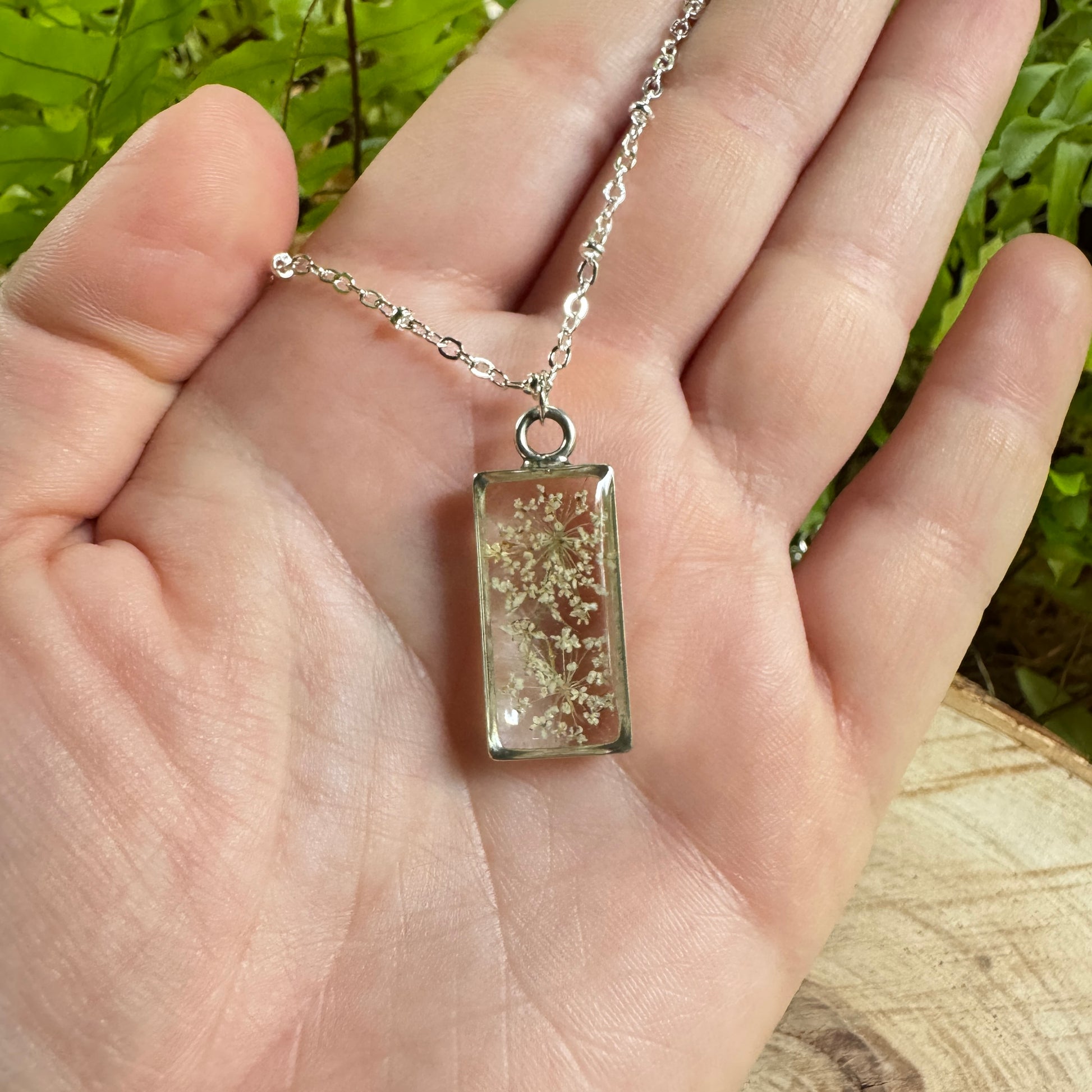 Queen Anne’s Lace necklace with real pressed flower in resin and silver bezel