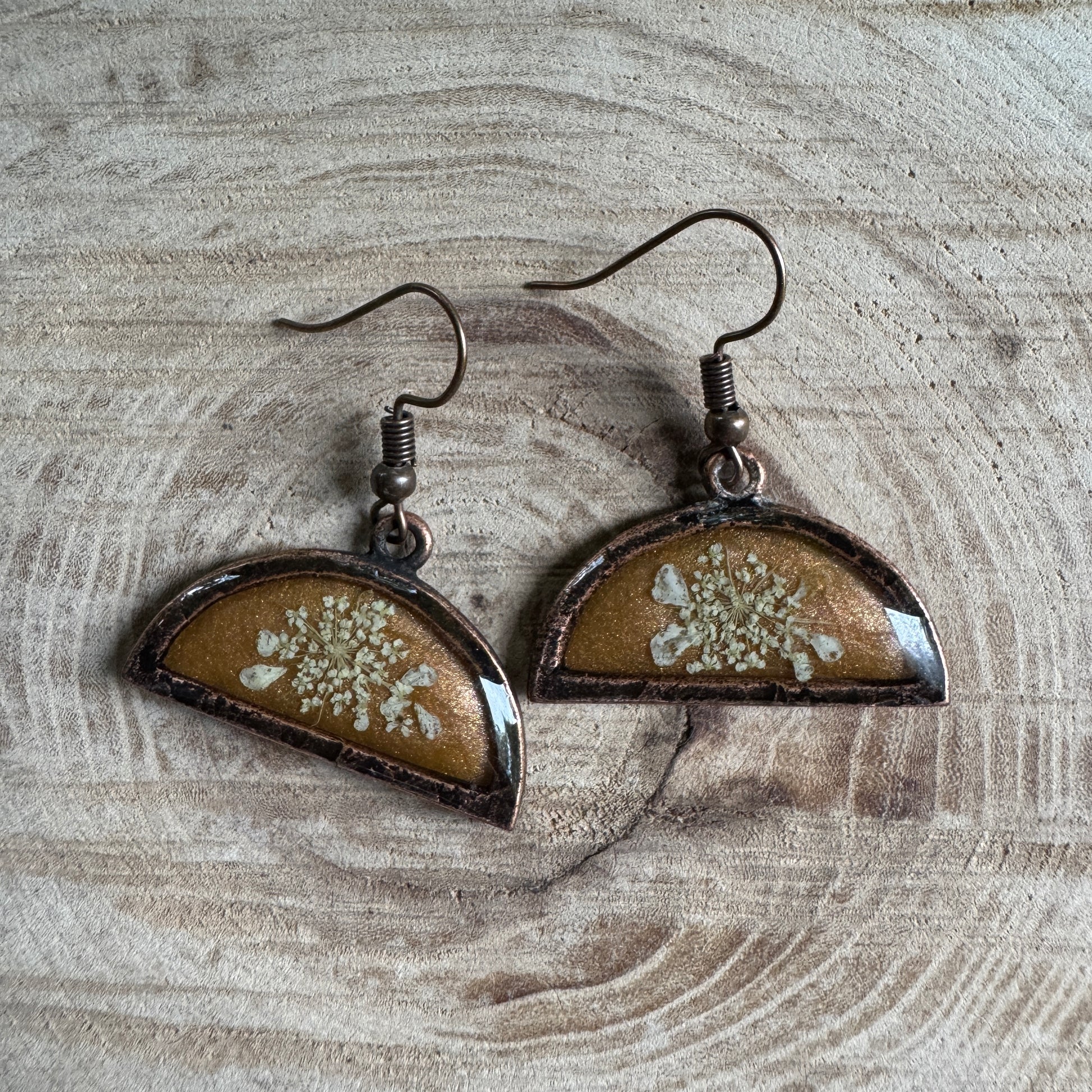 Queen Anne’s Lace flower earrings preserved in resin with copper bezel