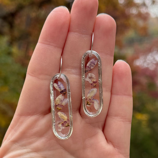 Earrings with real Eastern Redbud petals preserved in resin and silver bezels