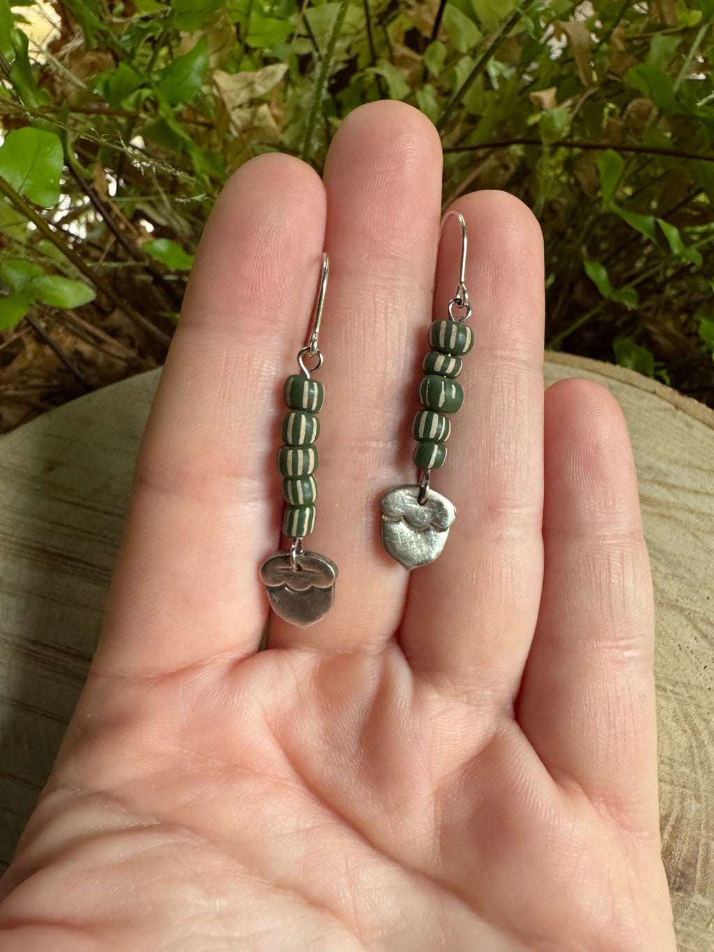 Silver acorn earrings with sculpted detail and forest-inspired design