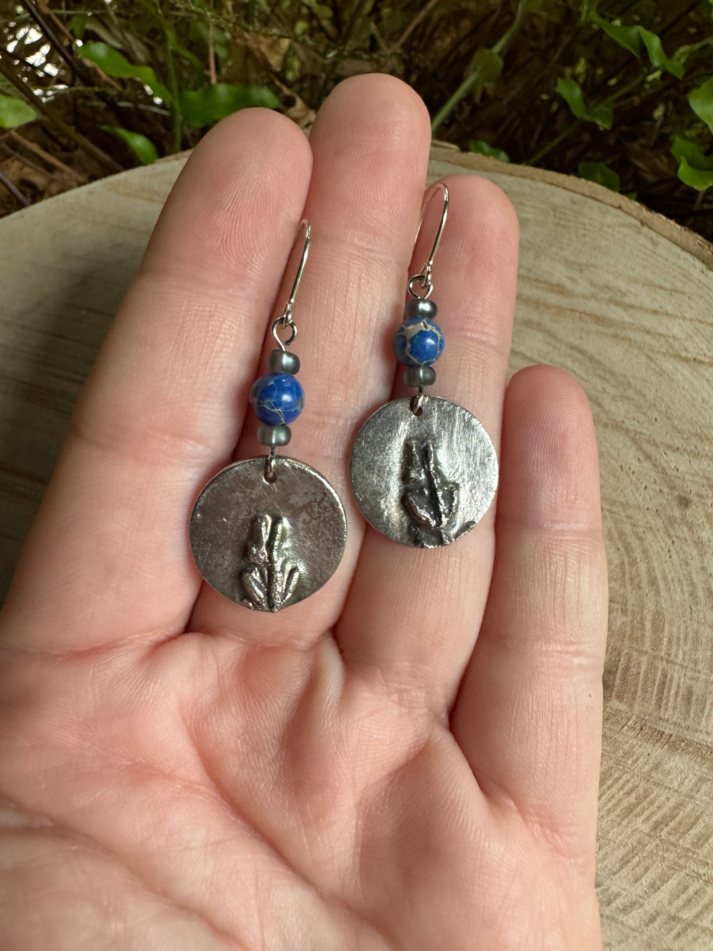 Sculpted silver lavender earrings with detailed botanical design
